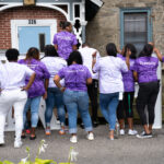 RHD faculty taking a group photo display different affirmations