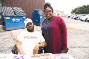 RHD worker and participant sharing a moment of happiness